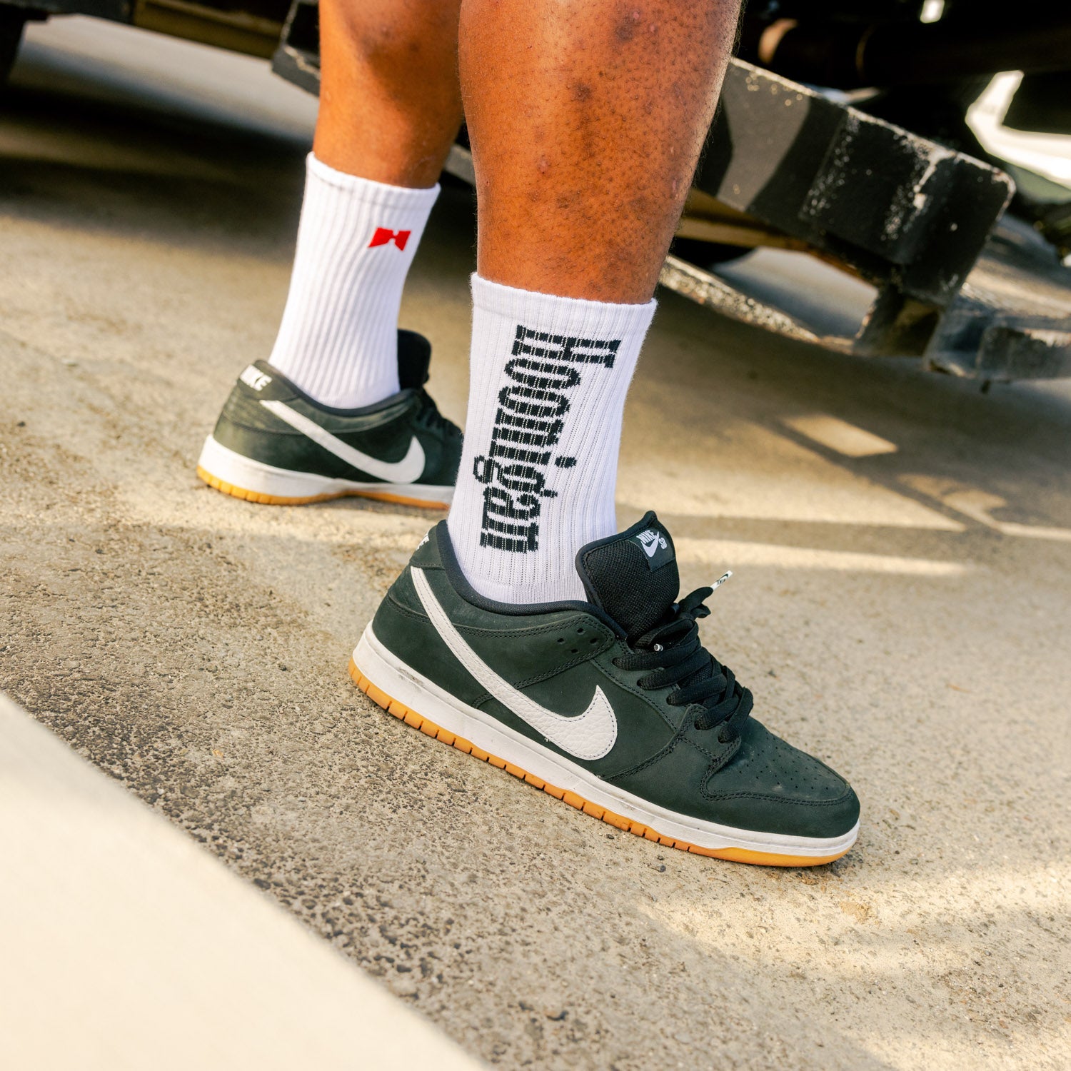 Hoonigan BURNOUT TEAM socks featuring a bold design with the Hoonigan logo and burnout graphic, perfect for motorsport enthusiasts.