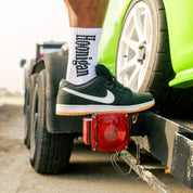 Hoonigan BURNOUT TEAM socks featuring a black and white design with flame graphics and the Hoonigan logo.