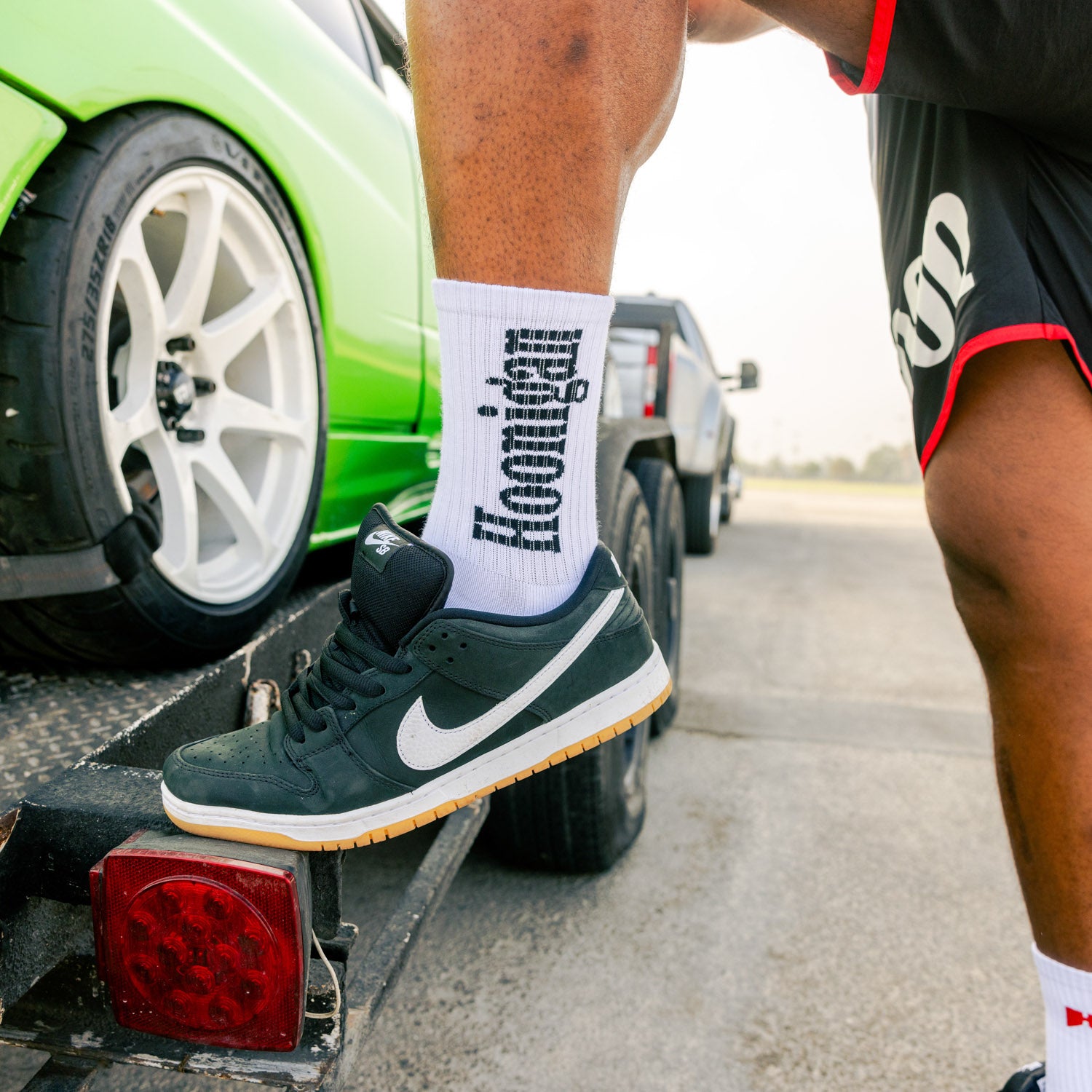 Hoonigan BURNOUT TEAM socks featuring a bold graphic design, ideal for motorsport enthusiasts and casual wear.