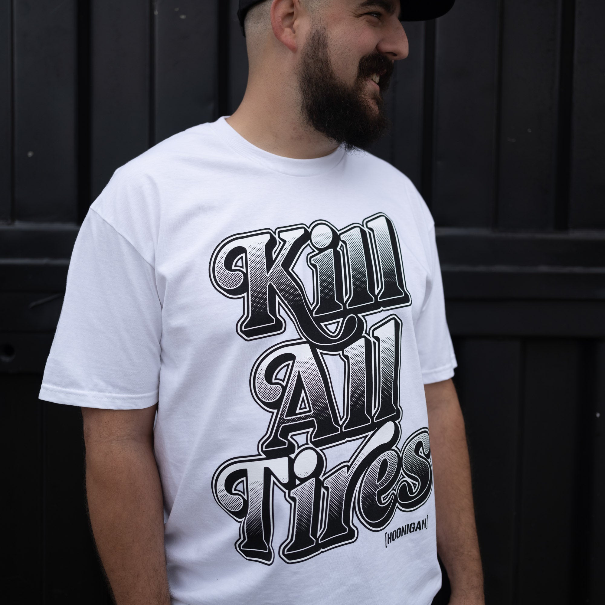 Hoonigan KILL ALL TIRES V2 Short Sleeve Tee in black, featuring bold white graphic text and a comfortable fit.