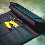 Hoonigan LIL TOOL ROLL featuring a black fabric design with yellow tools neatly arranged inside.