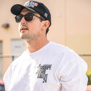 Hoonigan X RWB GROUPE RALLYE Short Sleeve Tee featuring a bold graphic design on a black cotton fabric.