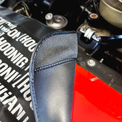 Hoonigan SCATTER PRINT Fender Cover featuring a vibrant scatter design with Hoonigan branding, designed to protect car fenders during maintenance.