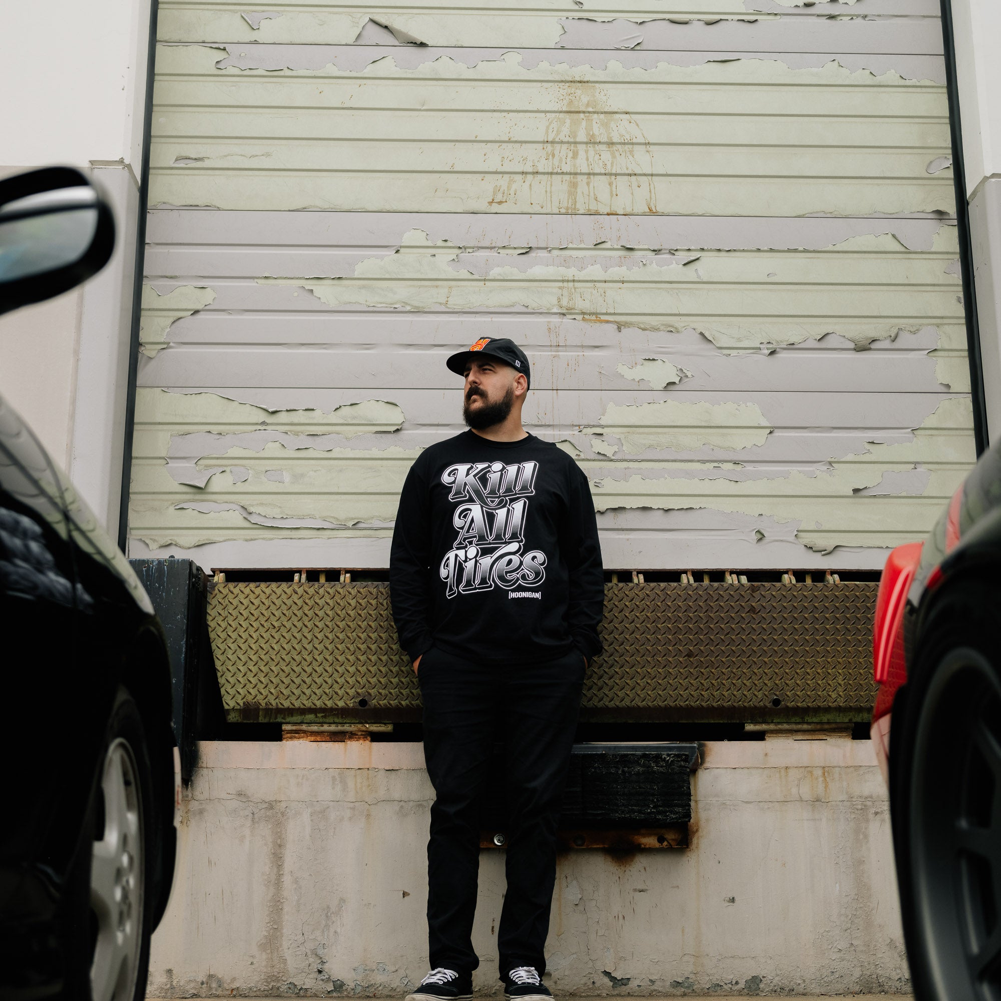 Hoonigan KILL ALL TIRES V2 Long Sleeve Tee featuring bold graphic design on black fabric, ideal for motorsport enthusiasts.