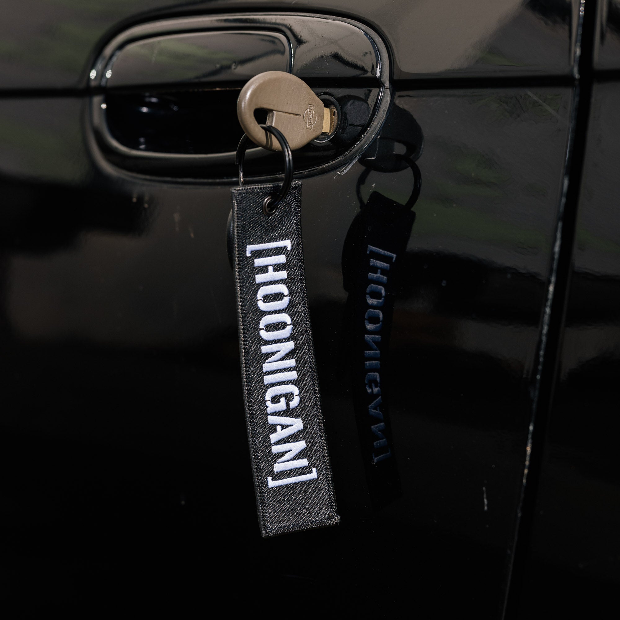 Hoonigan CENSOR BAR Jet Tag Keychain featuring a bold black and white design with the Hoonigan logo.