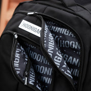 Hoonigan METAL BAR Backpack in black, featuring a durable design with adjustable straps and a Hoonigan logo.