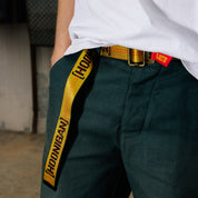 Hoonigan RATCHET Web Belt featuring a durable fabric design and a metal buckle with a prominent Hoonigan logo.