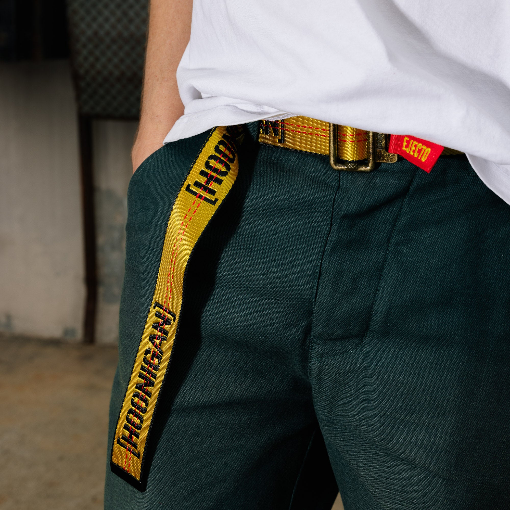 Hoonigan RATCHET Web Belt featuring a durable fabric design and a metal buckle with a prominent Hoonigan logo.