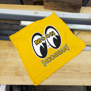 Yellow shop towel featuring the Hoonigan and Mooneyes logos, perfect for automotive enthusiasts and garage use.