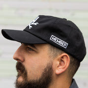 Hoonigan MAYHEM Unstructured Strapback Hat in black with embroidered logo on the front.