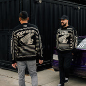 Hoonigan TIRE SLAYER Ugly Xmas Pullover featuring a festive design with automotive motifs and bold graphics on a green background.