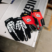 Hoonigan SURGEON GENERAL gloves featuring a black and white design with a graphic print and logo.