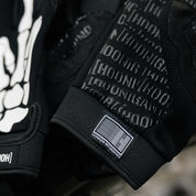 Hoonigan FIND OUT Gloves featuring a black and yellow design with the Hoonigan logo, designed for motorsport activities.