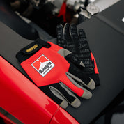 Hoonigan Surgeon General gloves featuring black fabric with white logo and design accents.