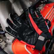 Hoonigan SURGEON GENERAL gloves featuring a bold design with white and black colors, designed for motorsport enthusiasts.