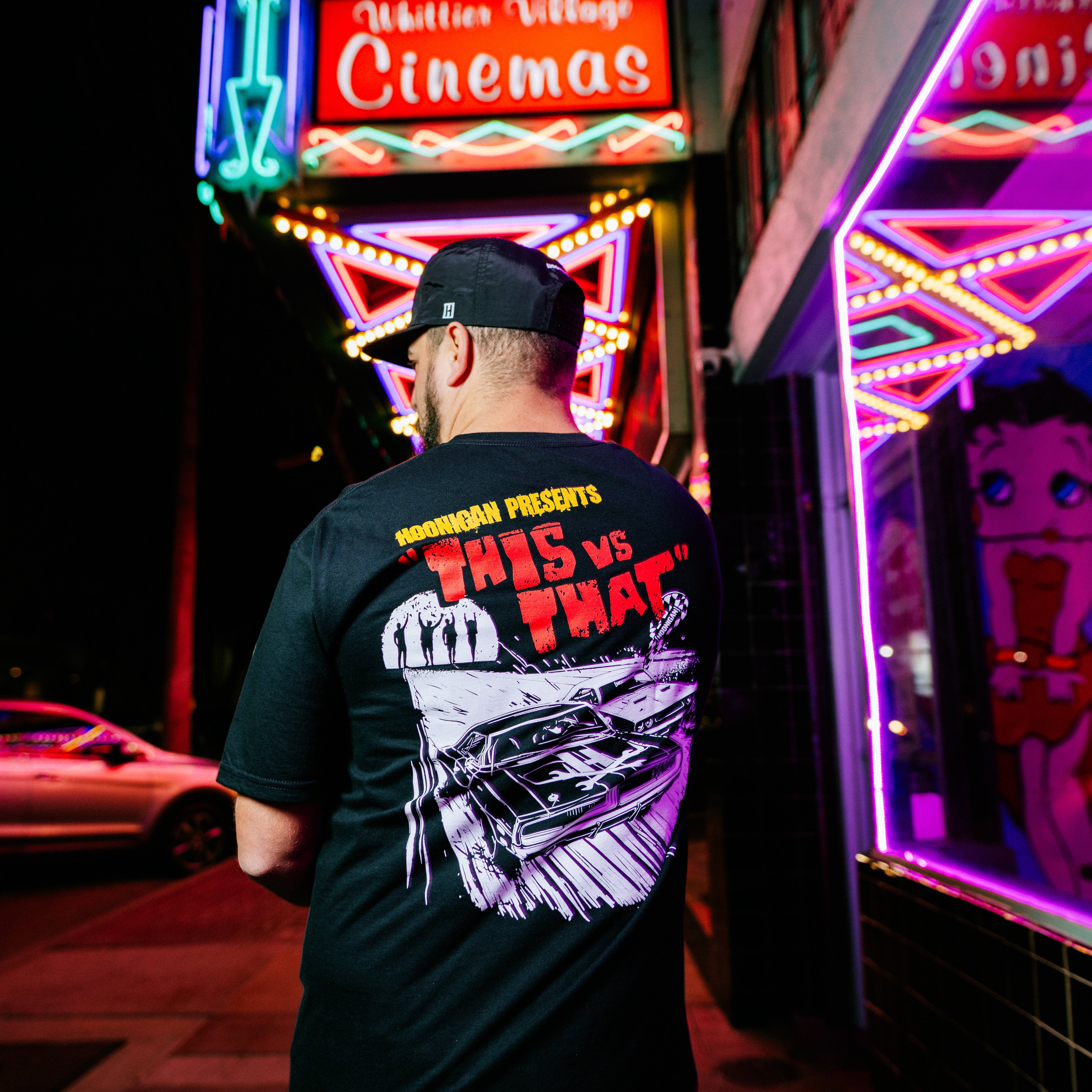 Hoonigan DOUBLE FEATURE Short Sleeve Tee featuring a graphic print on a black fabric, perfect for automotive enthusiasts.