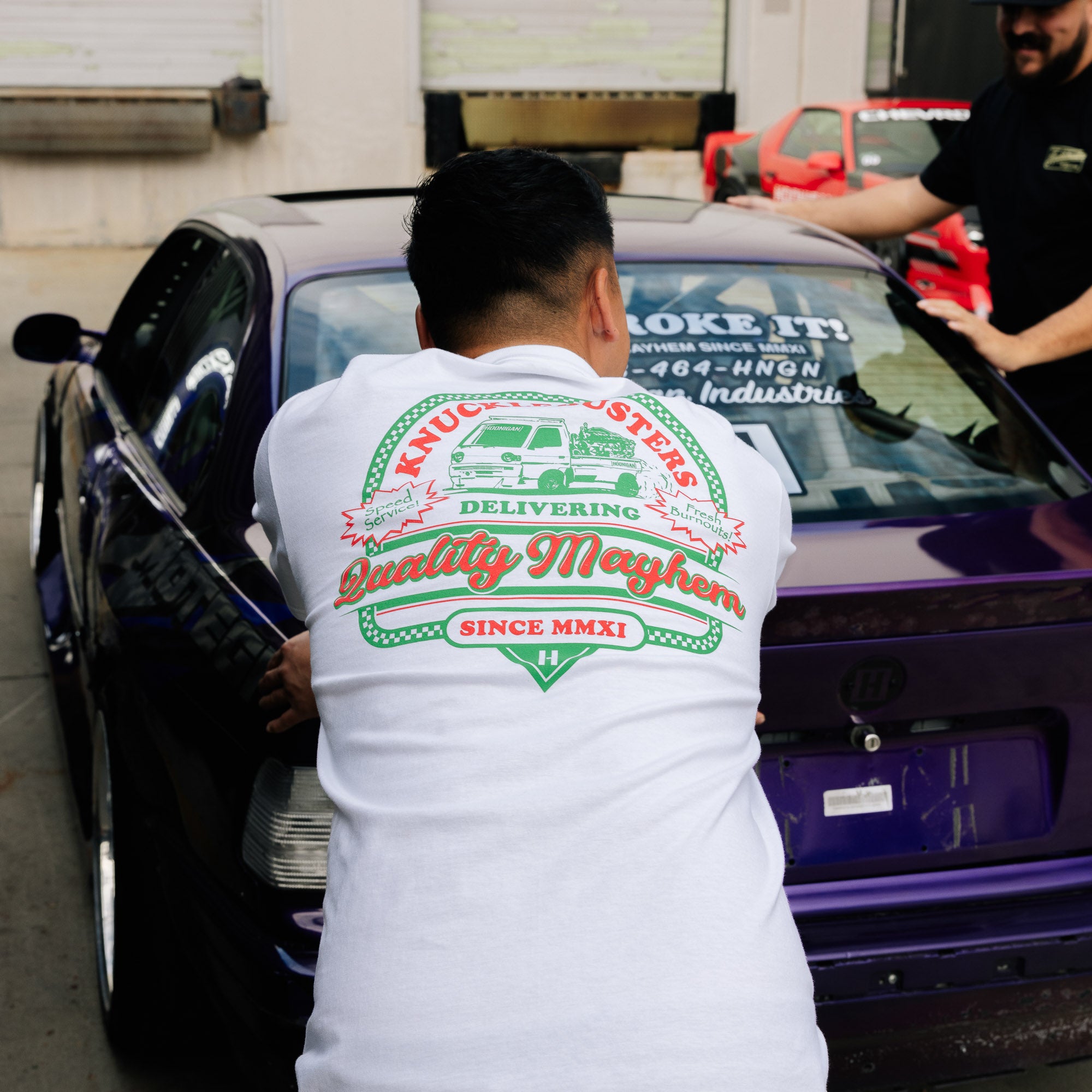 Hoonigan SPEED DELIVERY Short Sleeve Tee featuring a bold graphic design in black and white, showcasing a racing theme on a classic t-shirt.