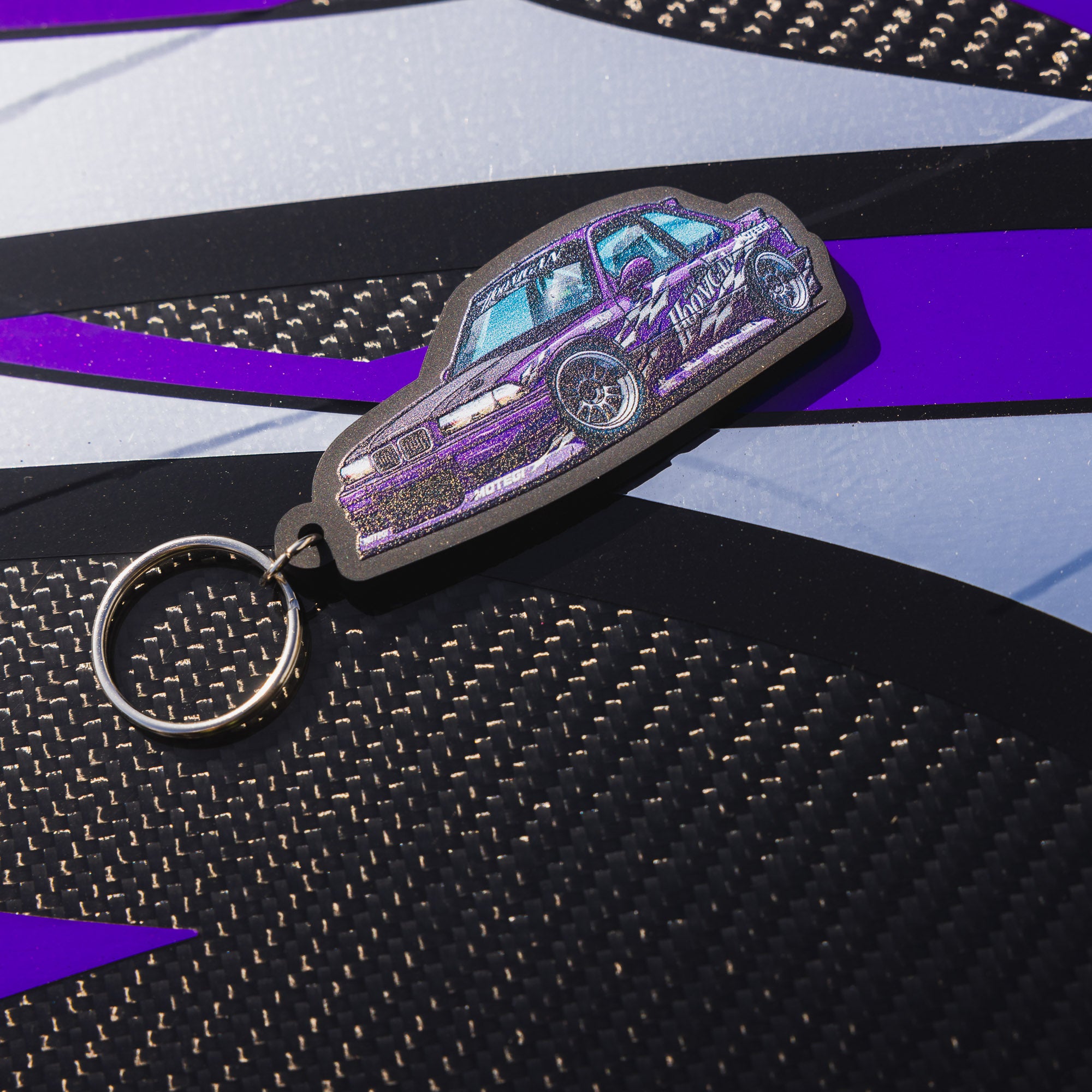 Hoonigan SD Series keychain featuring a sleek design with a metal logo and a durable keyring.