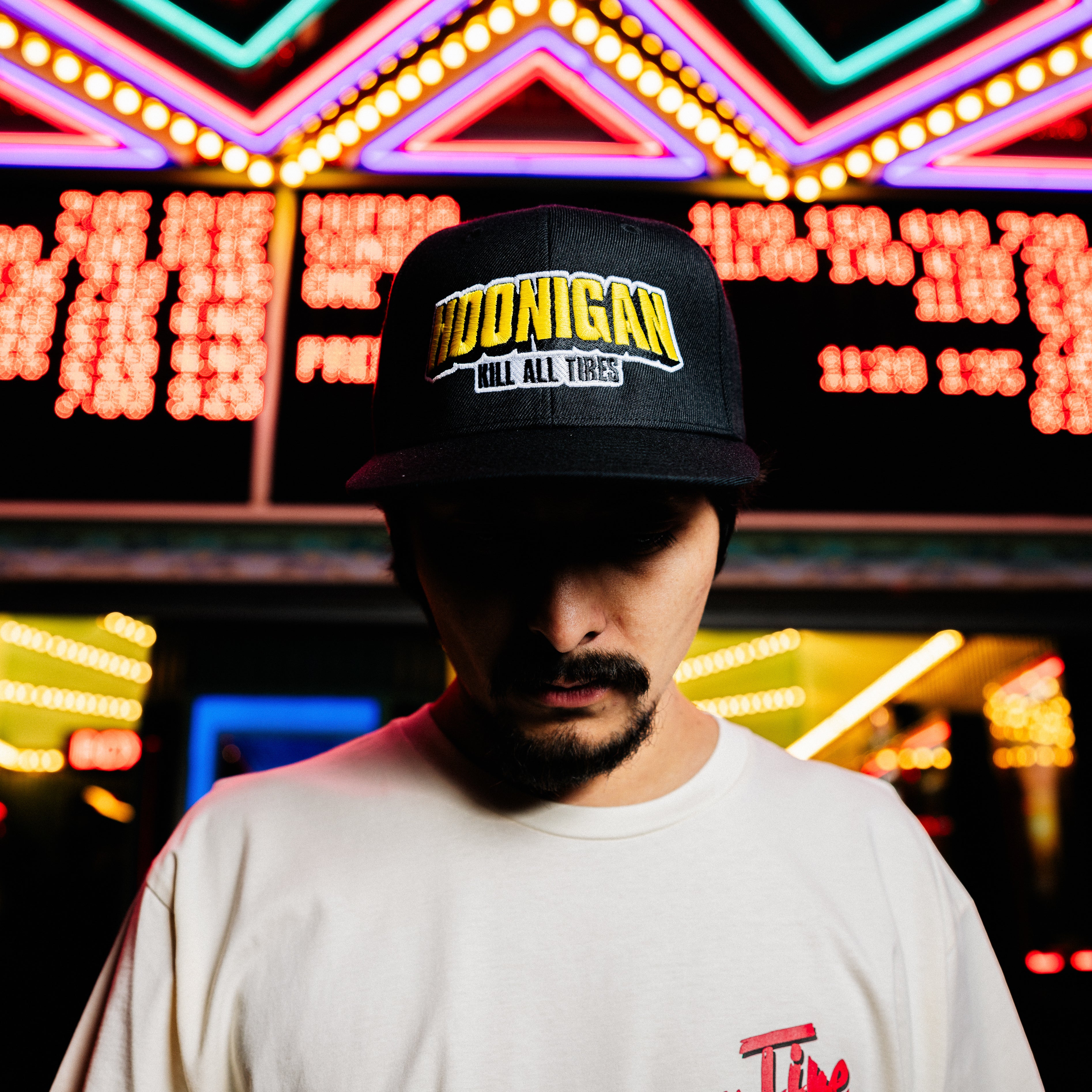 Hoonigan KING OF MONSTERS 6 Panel Snapback Hat in black with a vibrant graphic and adjustable snap closure.