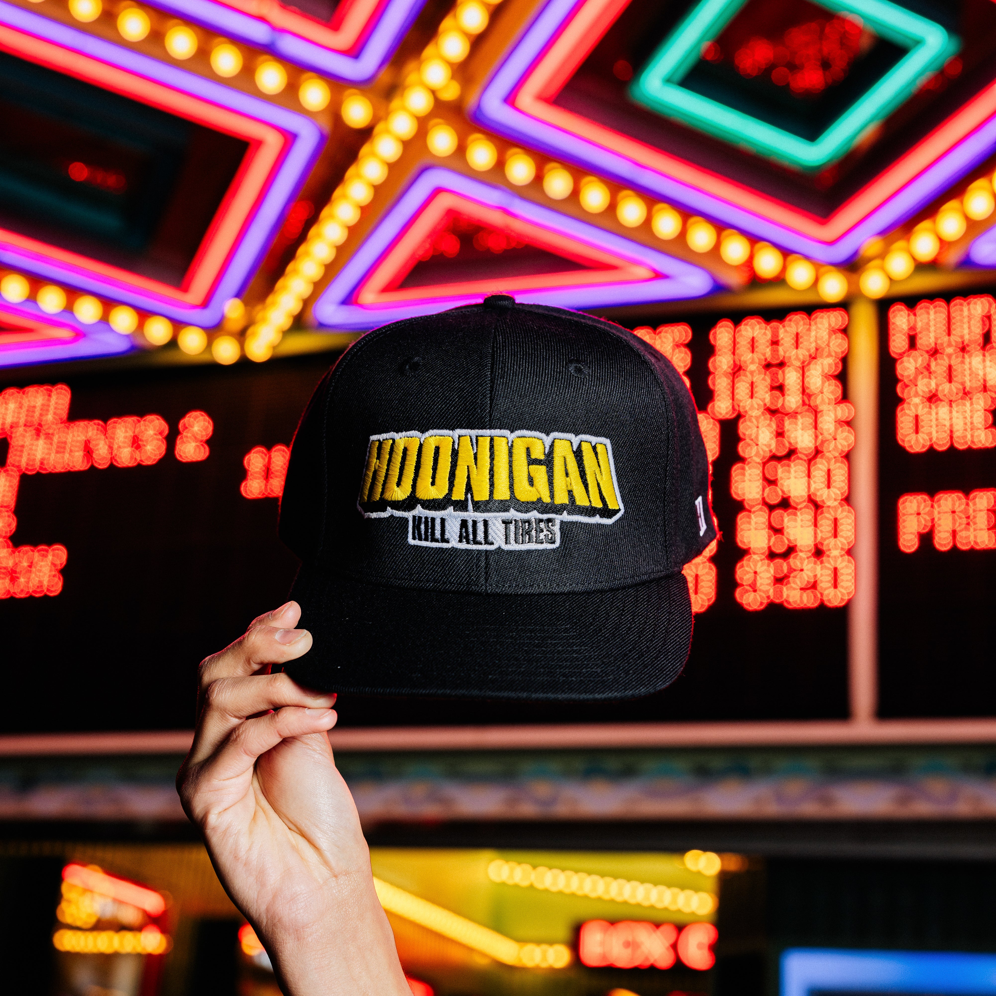 Hoonigan King of Monsters 6 Panel Snapback Hat in black with a bold graphic design on the front.