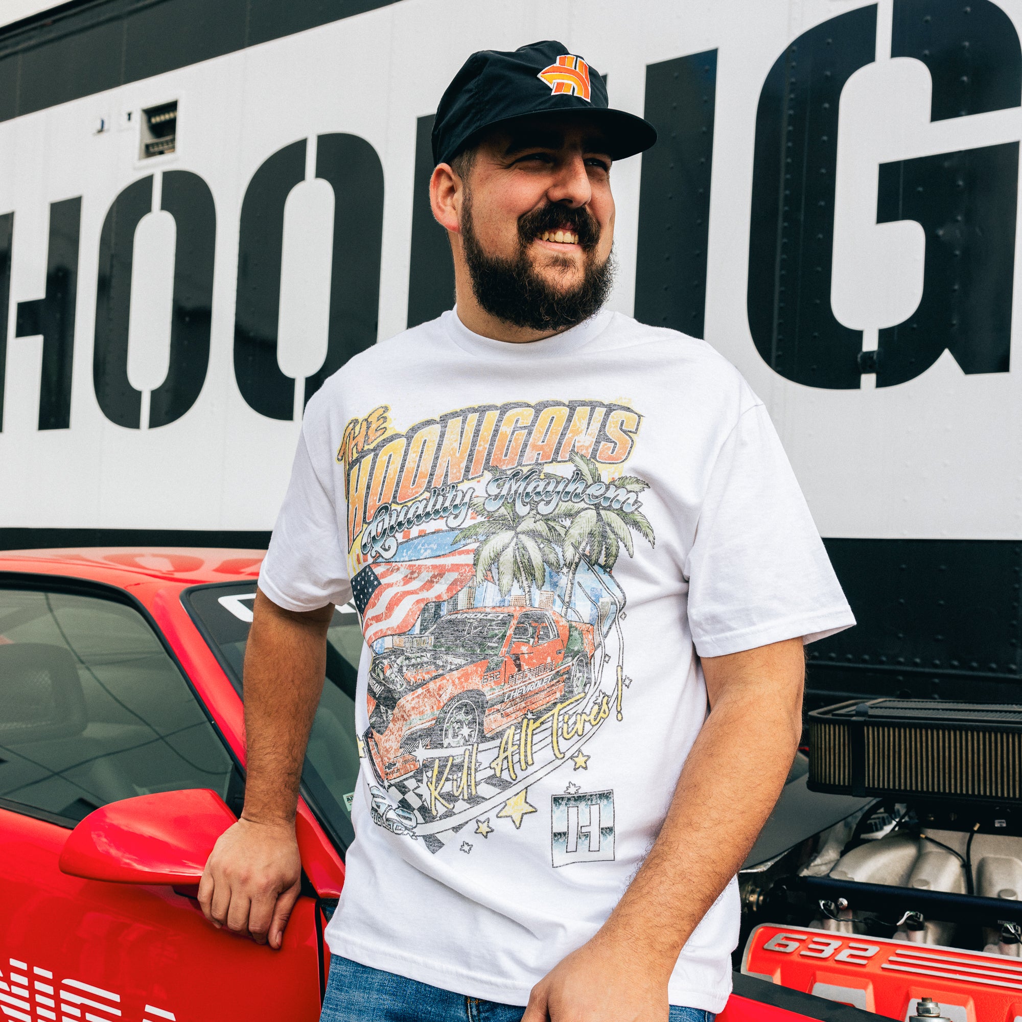 Black Hoonigan 632 short sleeve tee featuring a bold white logo on the chest and stylized graphic on the back.