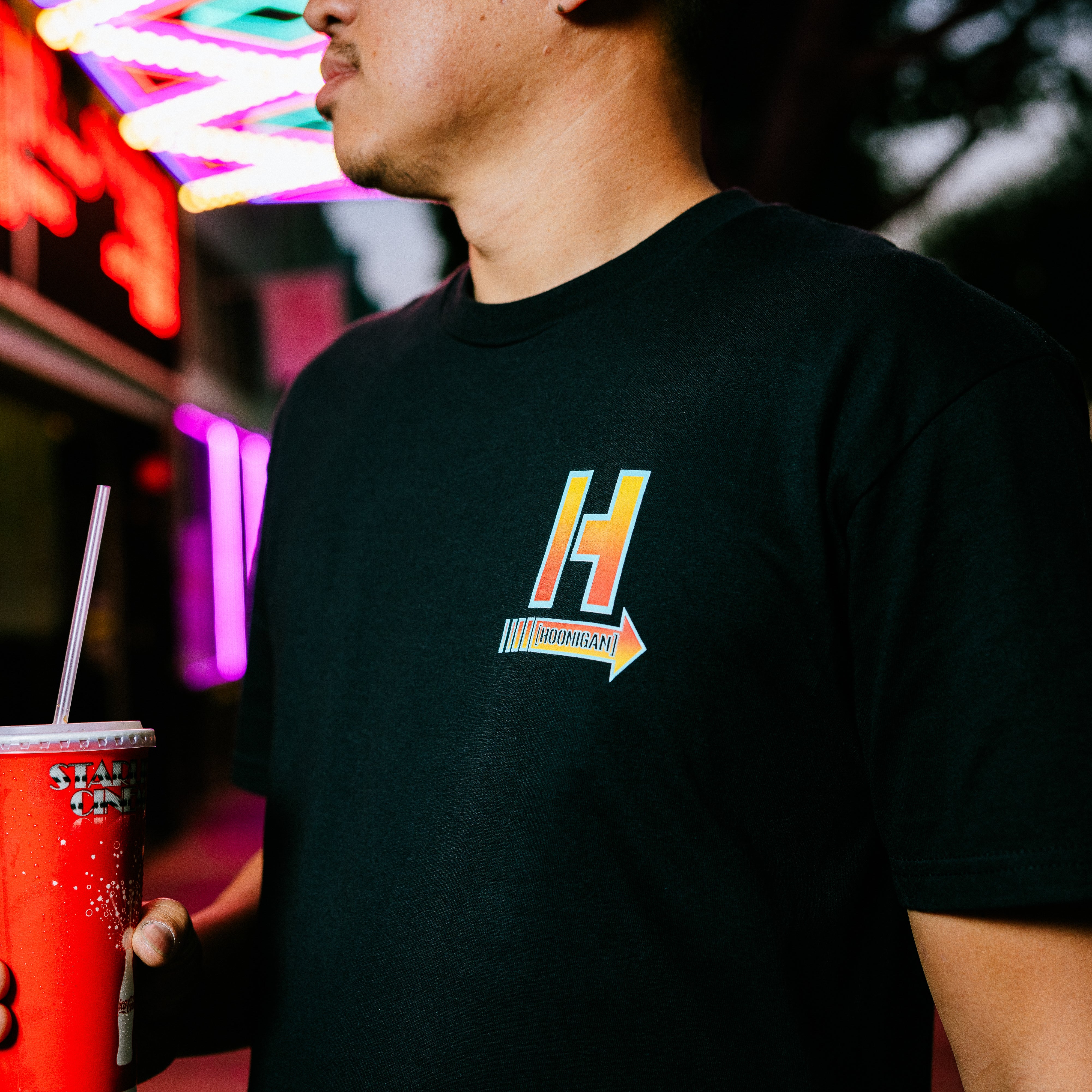 Hoonigan HOONCAPACITOR Short Sleeve Tee in black featuring a colorful graphic design of a capacitor with the Hoonigan logo.