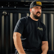 Hoonigan Knucklebusters Auto Repair short sleeve tee featuring a bold graphic design and black color.