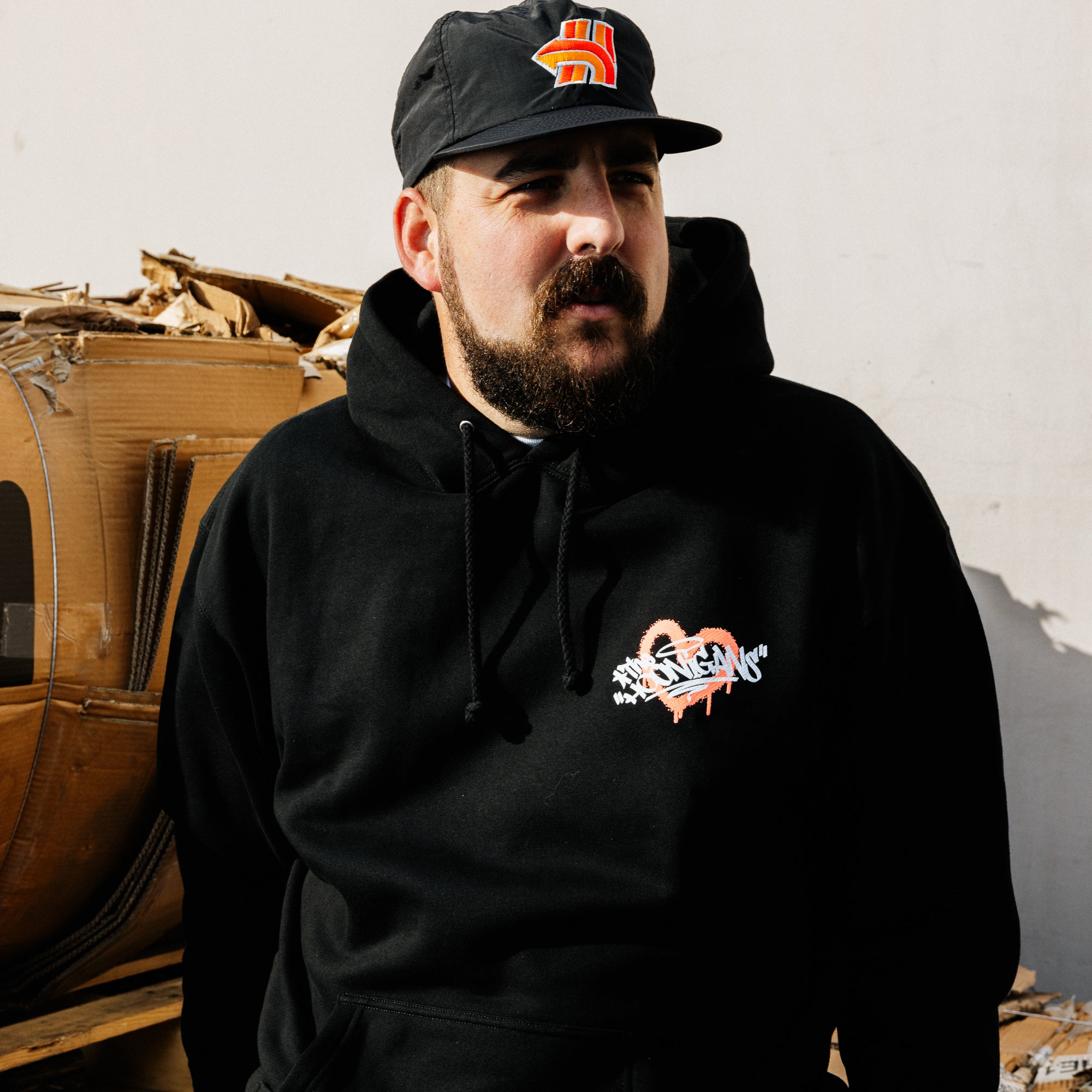 Black Hoonigan FIND OUT pullover hoodie featuring a bold graphic logo on the front, designed for a casual and sporty look.