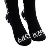 Hoonigan FINISHLINE II Crew Socks featuring a bold black and white design with racing graphics.