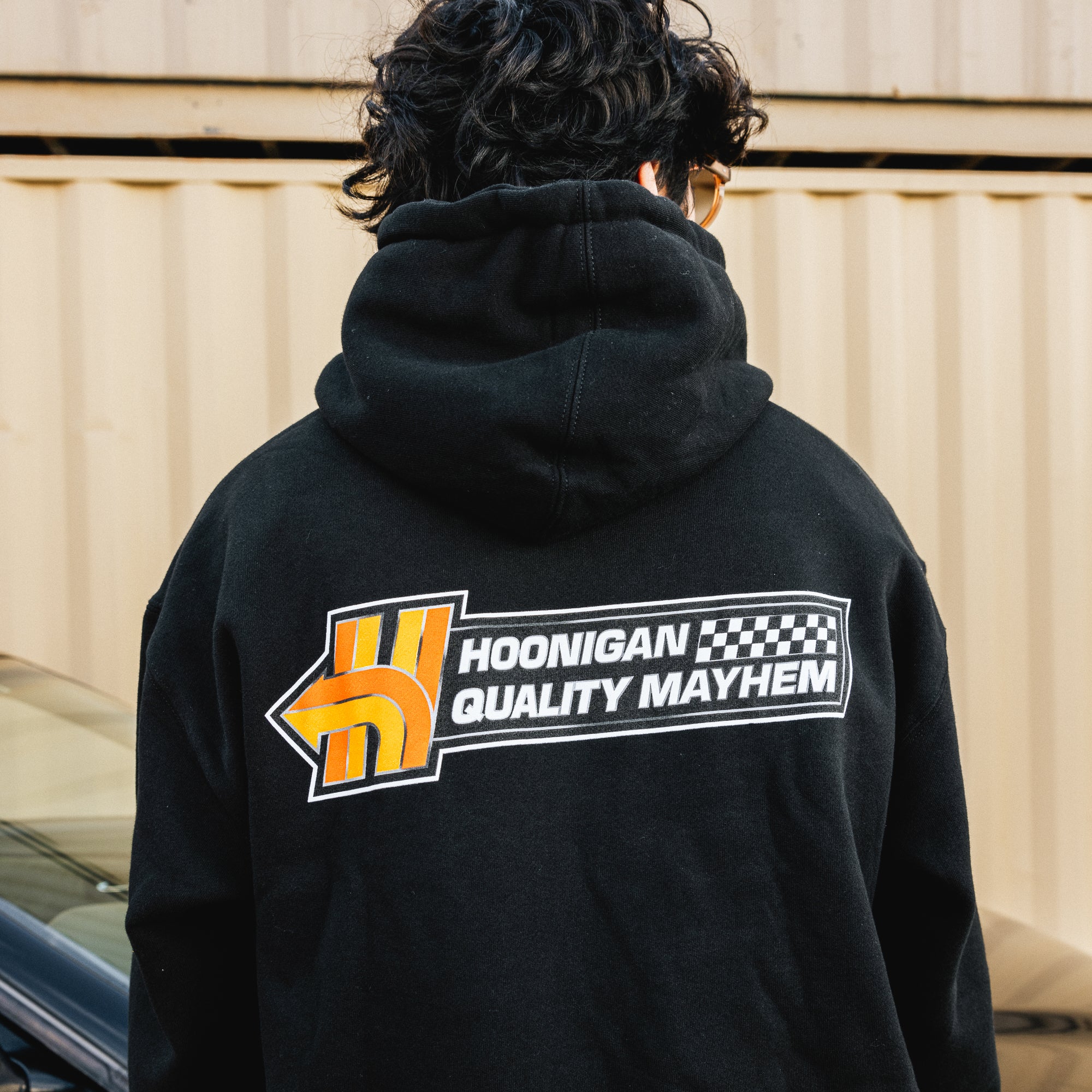 Black Hoonigan HNX pullover hoodie with white logo on the chest, featuring a classic fit and drawstring hood.