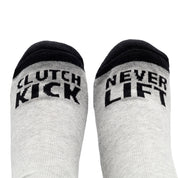 Black Hoonigan NEVER LIFT socks featuring white bold lettering and a logo, ideal for motorsport enthusiasts.