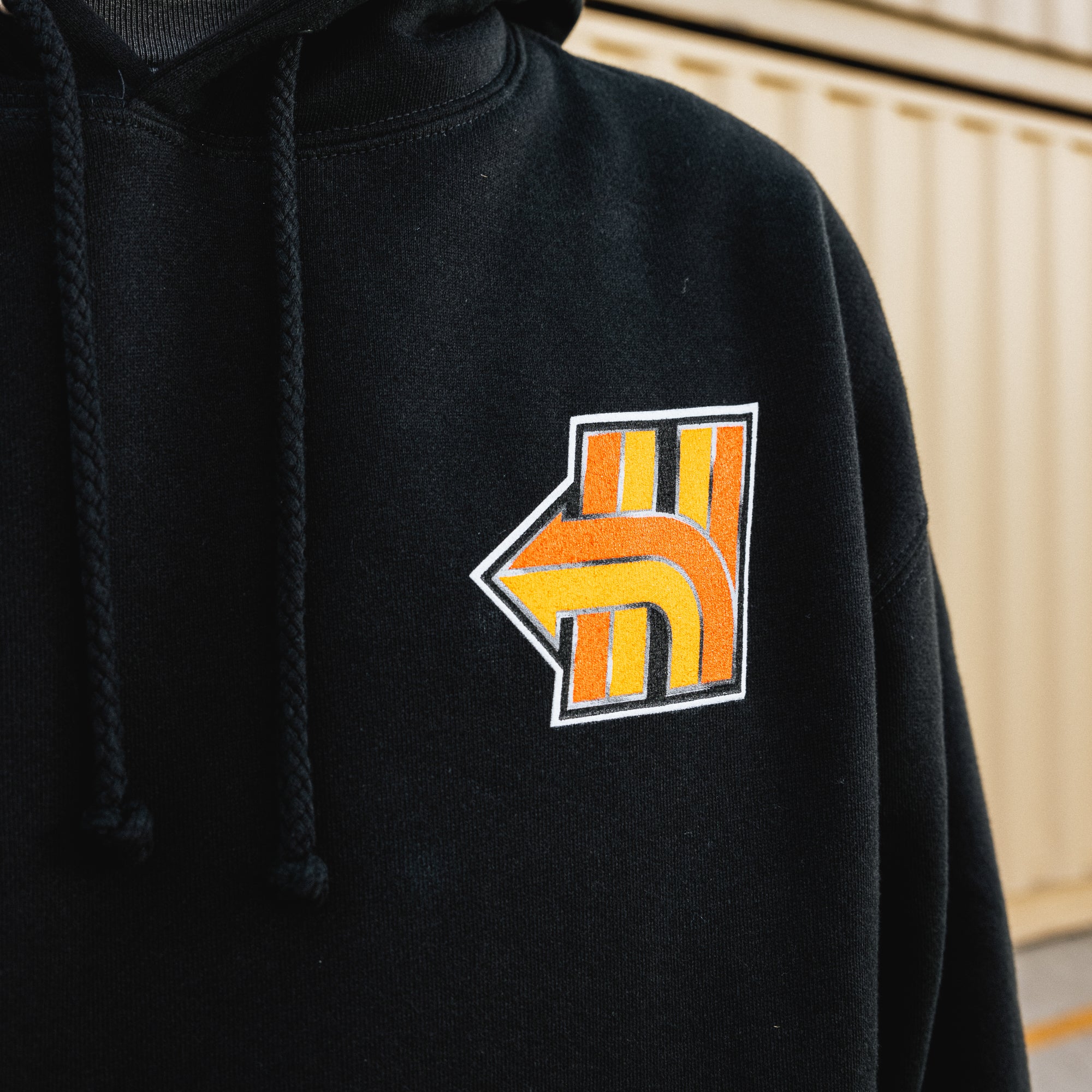 Black Hoonigan HNX pullover hoodie featuring a bold logo print on the chest and a drawstring hood.