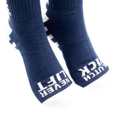 Hoonigan FINISHLINE II Crew Socks featuring a black base with contrasting white and red graphics, ideal for motorsport enthusiasts.