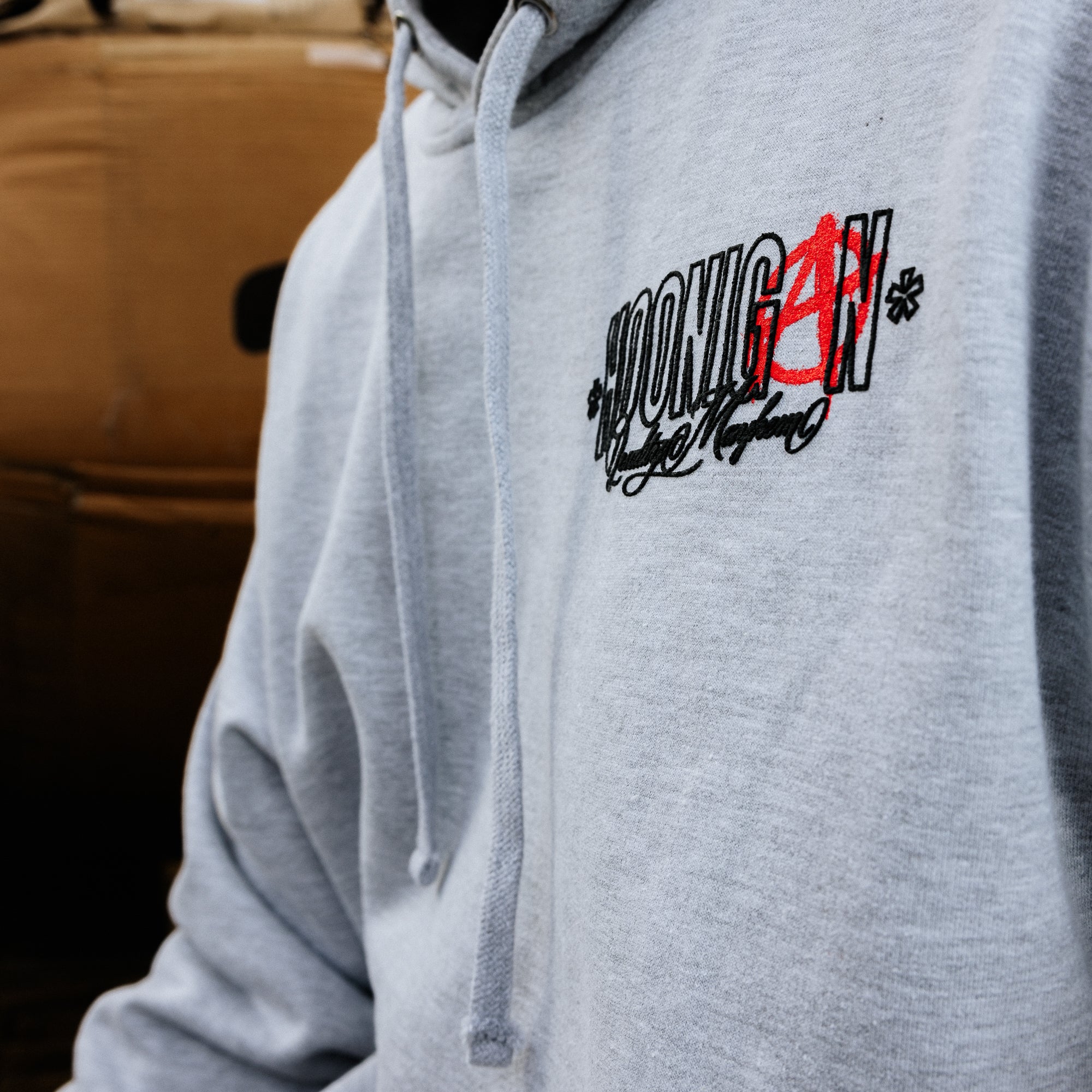 Hoonigan HOONARCHY pullover hoodie in black with bold white graphic design, featuring a front kangaroo pocket and adjustable drawstrings.