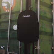 Hoonigan CENSOR BAR Light Backpack featuring a sleek black design with bold Hoonigan branding and adjustable straps.