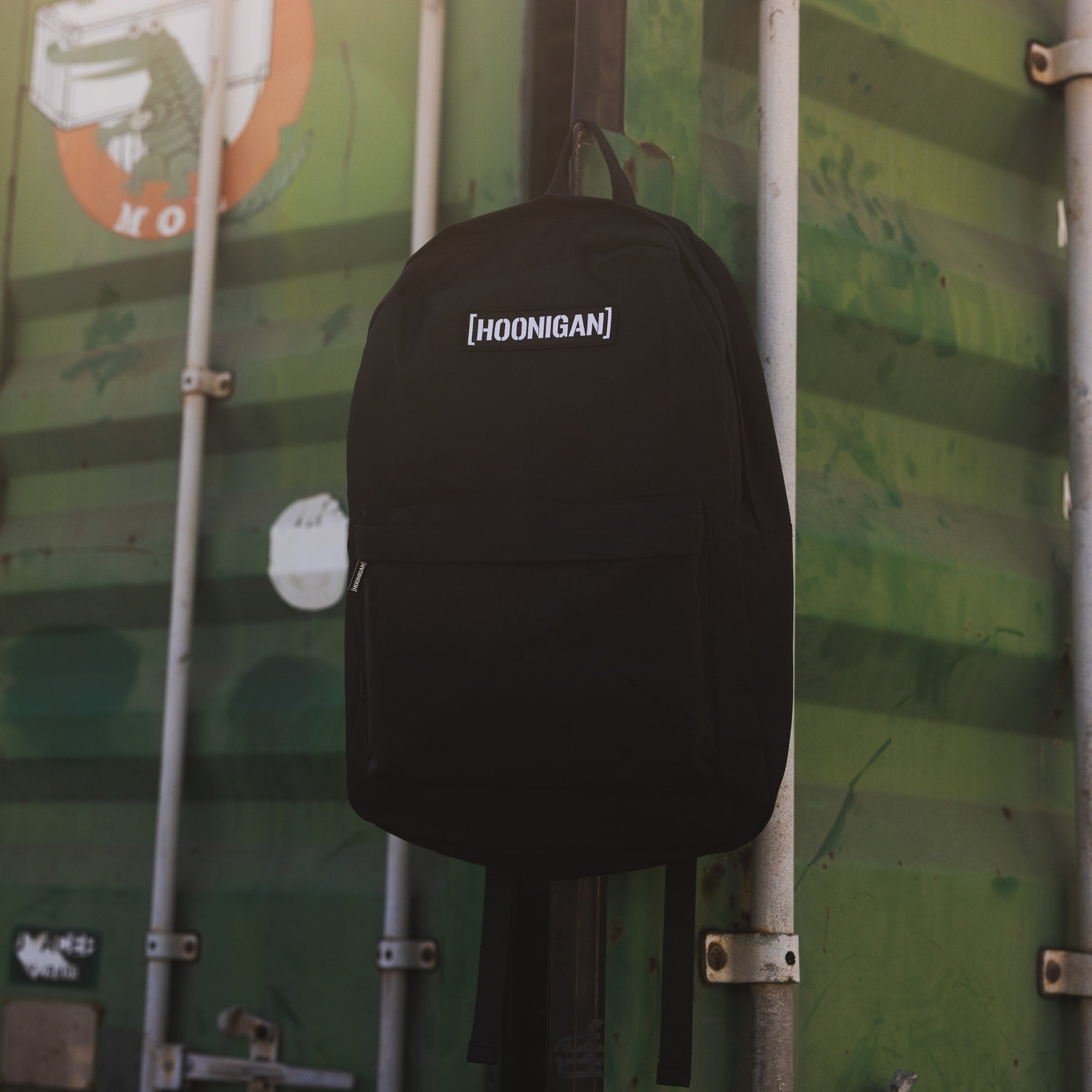 Hoonigan CENSOR BAR Light Backpack featuring a sleek black design with bold Hoonigan branding and adjustable straps.