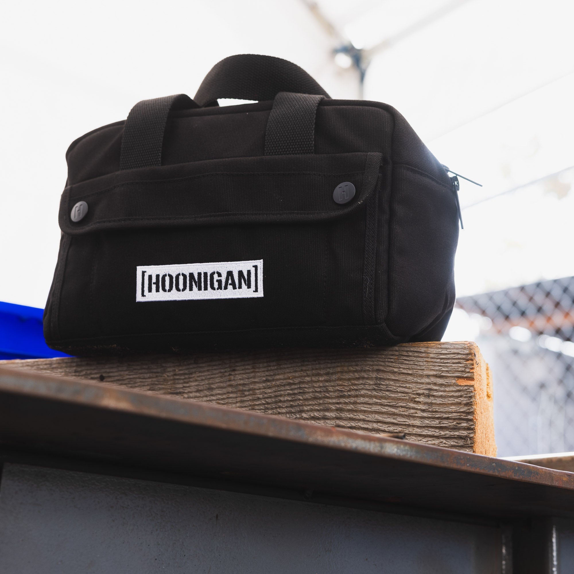 Hoonigan CENSOR BAR Tool Bag in black with multiple pockets and a distinctive logo design.