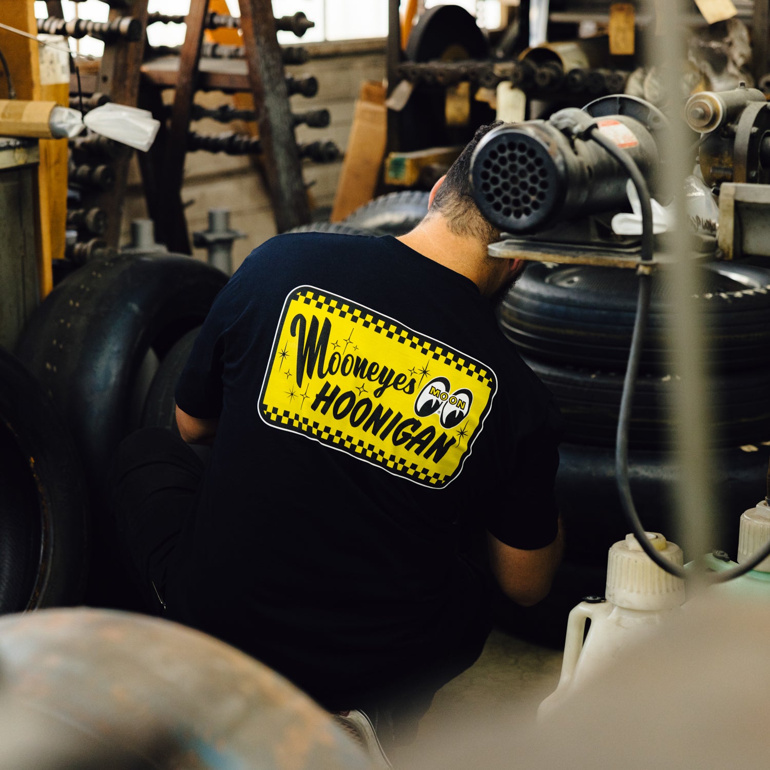 Hoonigan x Mooneyes "GO WITH HOON" short sleeve tee in black with white graphic print on the front.