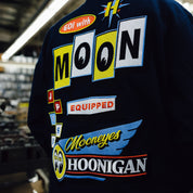 Hoonigan x Mooneyes MOON MOTEL Jacket featuring a bold graphic design, black fabric, and multiple front pockets.