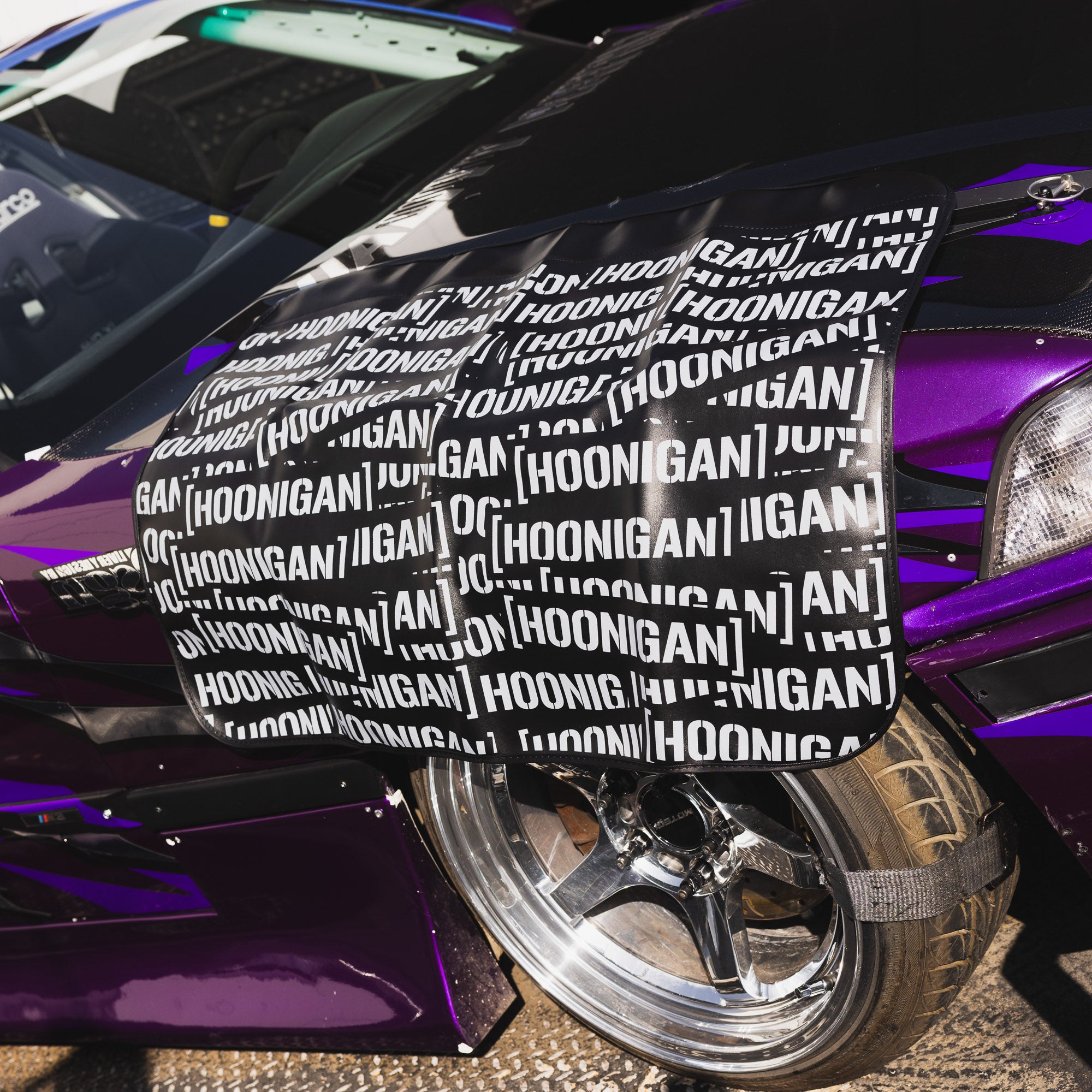 Hoonigan SCATTER PRINT Fender Cover featuring a colorful, dynamic design with logo and graphic elements.