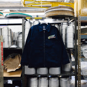 Hoonigan x Mooneyes MOON MOTEL jacket featuring a bold graphic design, vibrant colors, and a stylish fit, perfect for car enthusiasts.