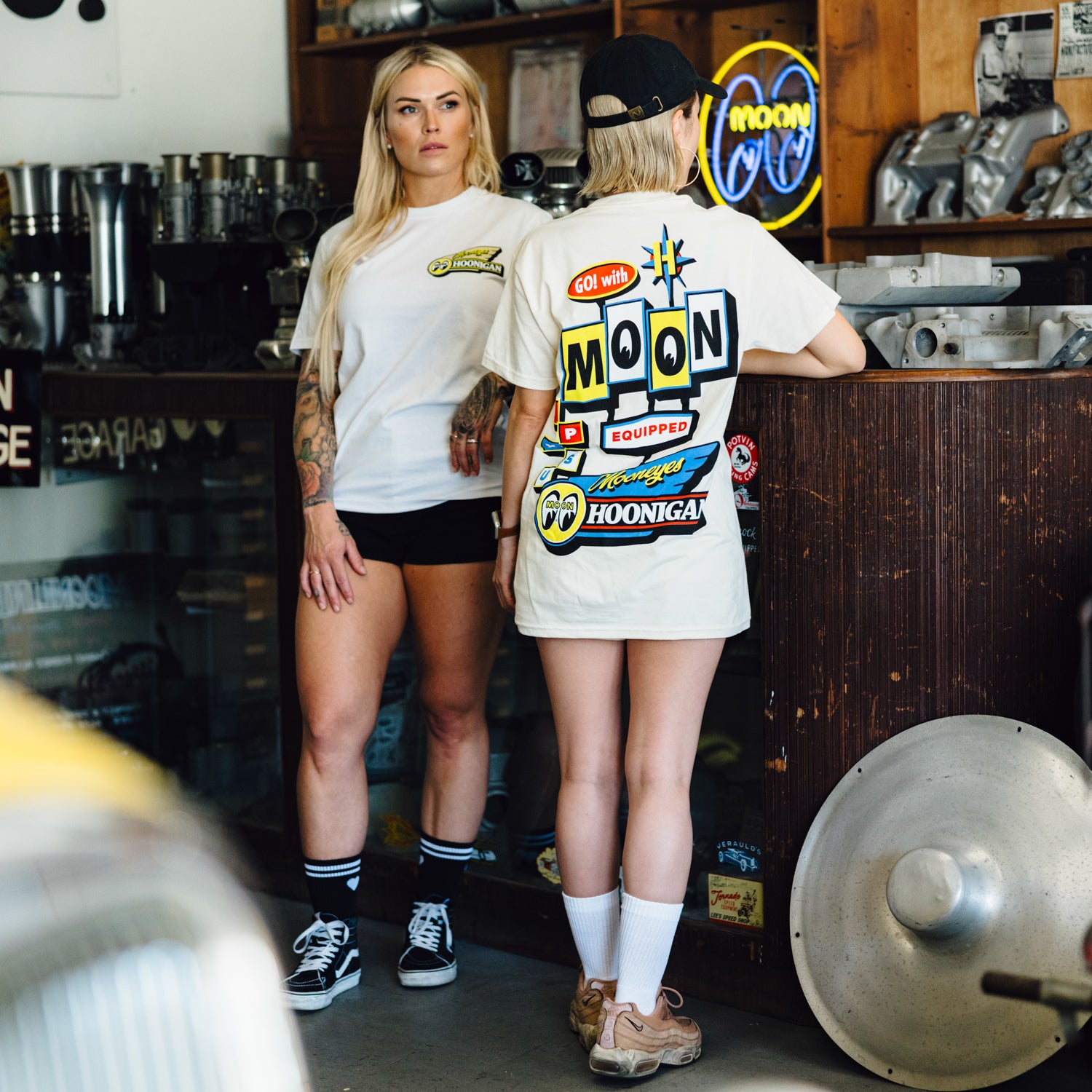 Hoonigan x Mooneyes MOONMOTEL short sleeve tee featuring a retro-inspired graphic design on a black fabric.