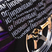 Hoonigan SCATTER PRINT Fender Cover with colorful scattered graphics on a black background.