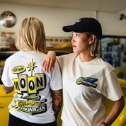 Hoonigan x Mooneyes MOONMOTEL Short Sleeve Tee featuring a graphic print on the front, black fabric, and a relaxed fit.