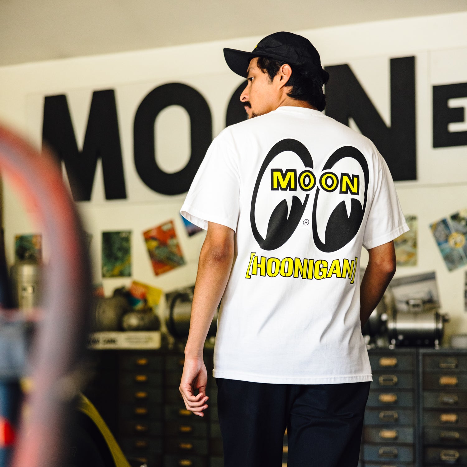 Hoonigan x Mooneyes HOON AND MOON Short Sleeve Tee featuring a graphic print of a car and moon on a black background.