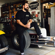 Hoonigan x Mooneyes short sleeve t-shirt featuring a graphic design with "HOON AND MOON" text, in black and yellow color scheme.