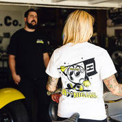 Hoonigan x Mooneyes short sleeve tee featuring a bold graphic design and vibrant colors on a black background.