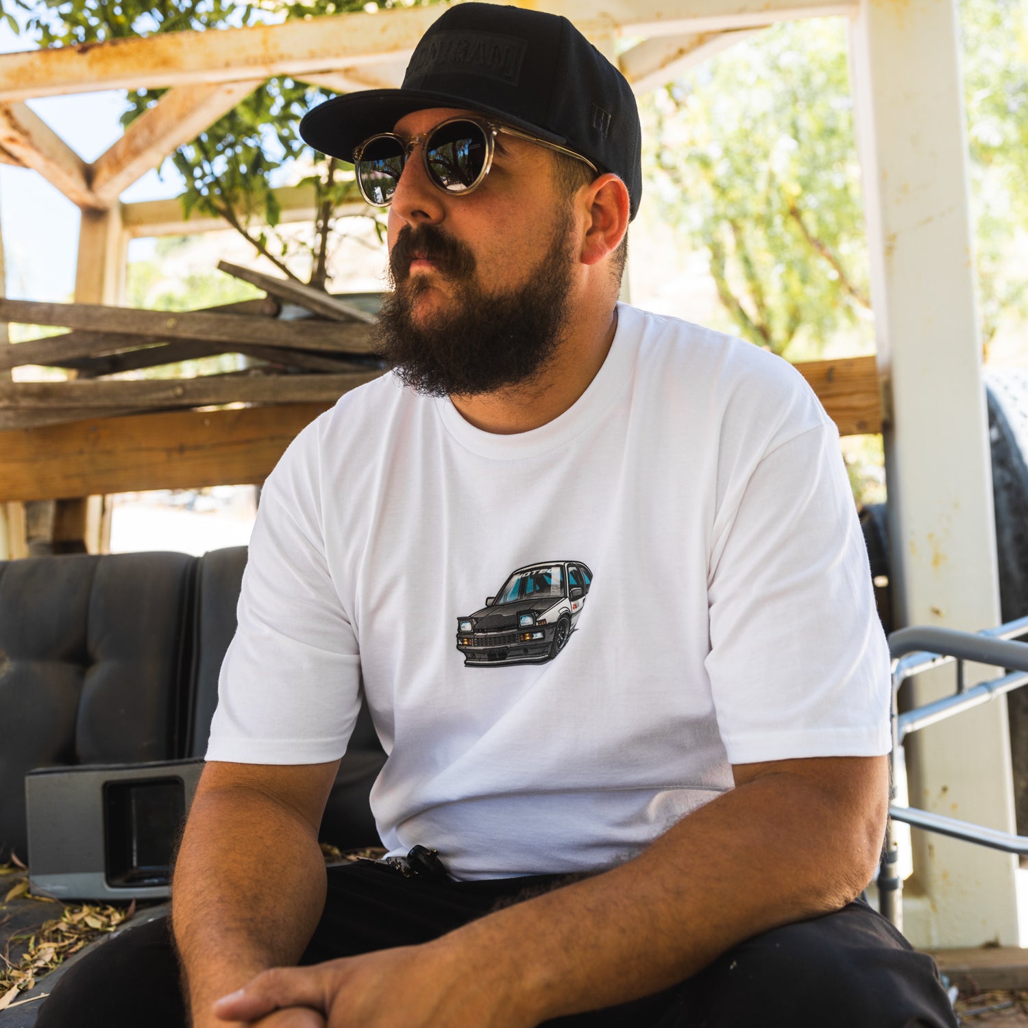 Motegi SD Series short sleeve tee featuring a bold graphic design on a black fabric.