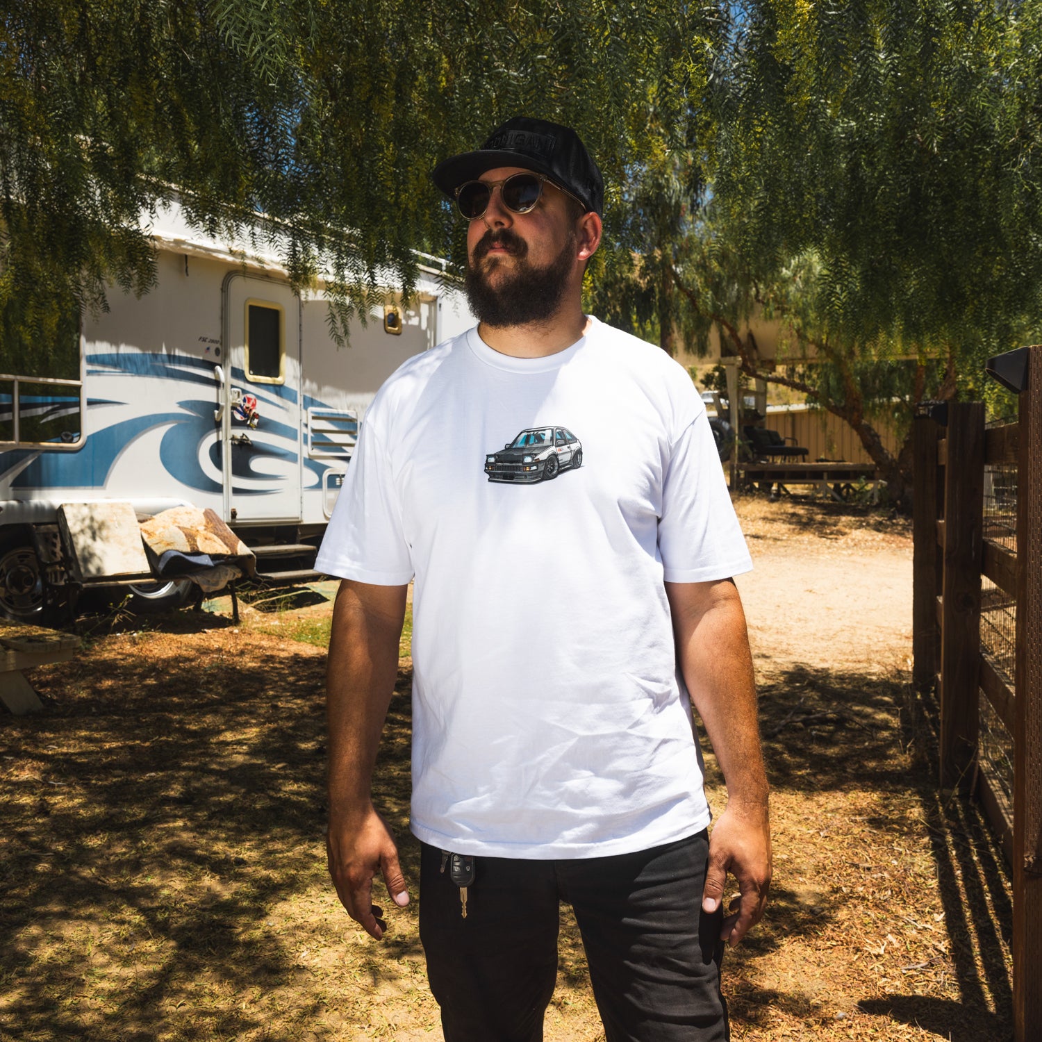 Motegi SD Series short sleeve tee featuring a bold graphic design on a black fabric.