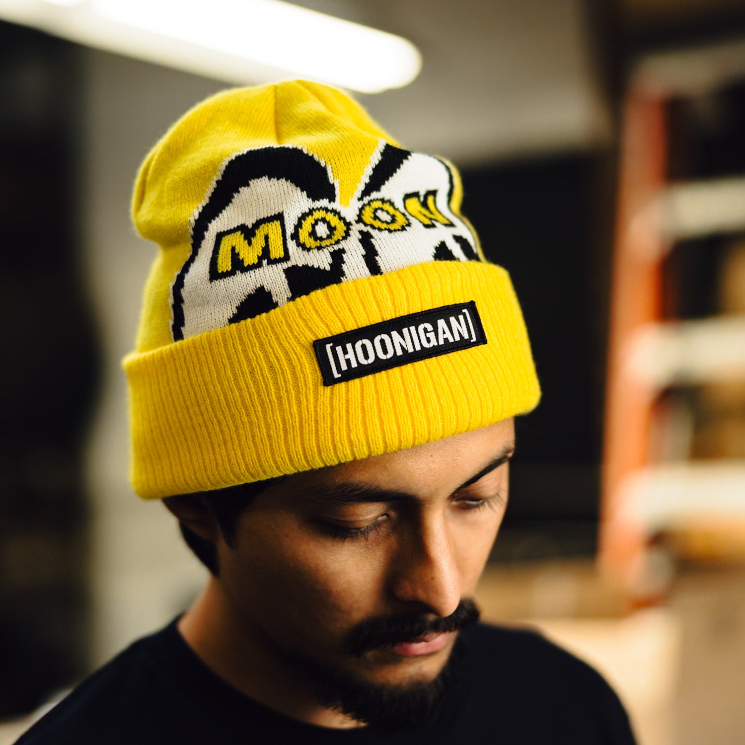 Hoonigan x Mooneyes LQQK Beanie in black with white logo graphics.